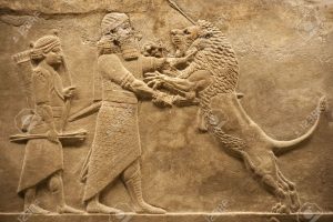 5710593-old-relief-representing-an-assirian-warrior-hunting-lions-stock-photo